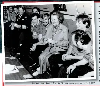  ??  ?? All smiles: Thatcher talks to submariner­s in 1982