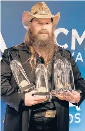  ?? ED RODE/AP ?? Chris Stapleton poses Wednesday with the awards he won at the 55th annual CMA Awards in Nashville, Tenn.