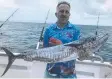  ?? ?? Spanish mackerel have been caught on floated pilchards while bottom fishing with Dragon Lady Charters off Port Douglas.