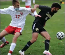  ??  ?? Oakland Christian’s Joshua Reyes (6) holds off Lutheran Northwest’s Nathan Jungeburg during Monday’s game.