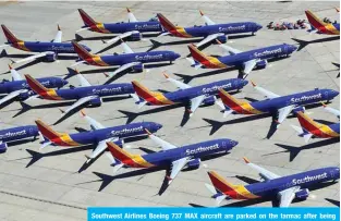  ??  ?? Southwest Airlines Boeing 737 MAX aircraft are parked on the tarmac after being grounded, at the Southern California Logistics Airport in Victorvill­e, California. — AFP