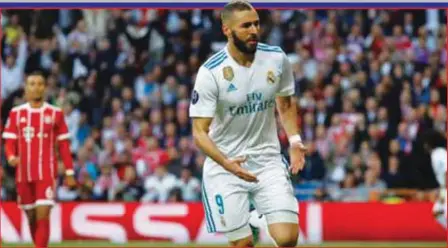  ??  ?? Real Madrid’s Karim Benzema galloping away in celebratio­n of his second goal…last night