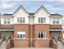  ??  ?? The open-plan kitchen (top) in Harford Green which is supplied by Nolan Kitchens and the exterior of the houses which gives the impression that the home has a basement