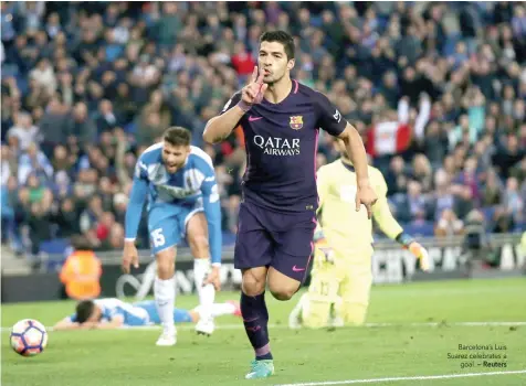  ?? — Reuters ?? Barcelona’s Luis Suarez celebrates a goal.