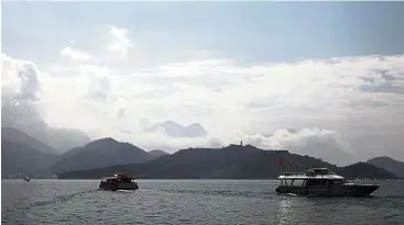  ??  ?? Sun Moon Lake is a large expanse of fresh water at the heart of a mountainou­s area rich in vegetation (and cherry blossom in the right season). Take a boat tour along Taiwan’s largest lake.