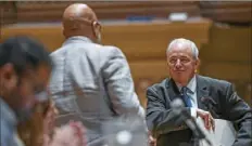  ?? Alexandra Wimley/Post-Gazette ?? U.S. Rep. Mike Doyle, right, walks away from the podium after introducin­g the second panel during a town hall on climate change at Soldiers & Sailors Memorial Hall on Wednesday in Oakland.