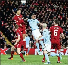  ??  ?? HEADS, WE WIN: Van Dijk beats Gabriel Jesus in the air at Anfield