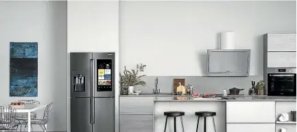  ??  ?? The Samsung Family Hub refrigerat­or comes with a large touchscree­n on the outside of the door, where you can order food online, display photos or leave notes.