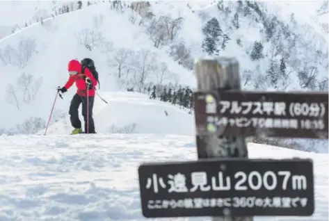  ?? Photo for The Washington Post by Robin O'Neill ?? Sarah Frood transition­s into downhill mode after a short hike up to the untracked slackcount­ry at Goyru Resort, Habuka, Japan.