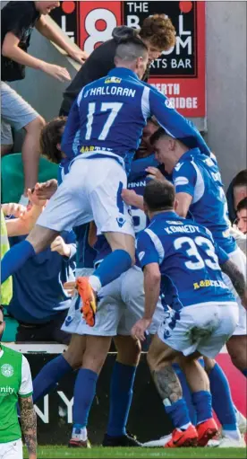  ??  ?? The St Johnstone players celebrate Jason Kerr’s late goal