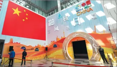 ??  ?? Visitors look around the China pavilion at the Astana Expo 2017 on Thursday. The pavilion, which opens on Saturday, shows off China’s energy developmen­t going into the future. Constructi­on of the pavilion began in January and was completed in May. It...