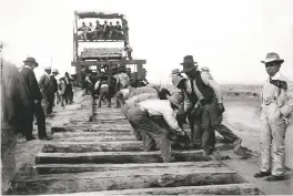  ??  ?? C.G. Kaadt, Track laying preparator­y to driving last spike on Santa Fe Central Railway (1903); Negative No. 014193