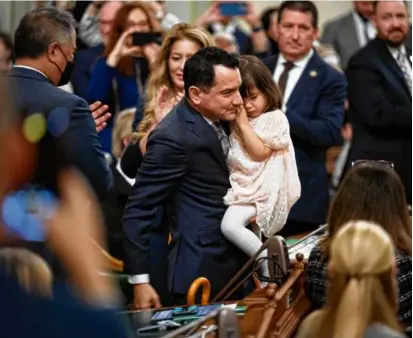  ?? JOSÉ LUIS VILLEGAS/ASSOCIATED PRESS/FILE 2022 ?? California Assemblyma­n Anthony Rendon, with his daughter Vienna at the opening session of the state’s Legislatur­e in 2022, wants happiness to be more central to policy making.