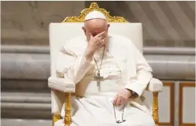  ?? AP PHOTO/ANDREW MEDICHINI ?? Pope Francis gestures Friday as he leads a prayer inside St. Peter’s Basilica, at The Vatican.