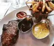  ?? ?? The classic Steak Frites with Bordelaise and Bearnaise sauces at Bruxelles in SoNo. Left, Vintage French Citroën and Deux Chevaux cars parked in front of the Rive Bistro set the stage for a French dinner.