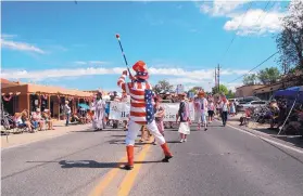  ?? STEVE KNIGHT/JOURNAL ?? A kazoo band made up of volunteers, including the Corrales Historical Society and the Friends of Corrales Library, performs at the 2018 Corrales Fourth of July Parade.