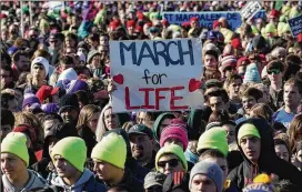  ?? ALEX WONG / GETTY IMAGES ?? Anti-abortion activists take part Friday in a rally on the National Mall in Washington, D.C., before the 2018 March for Life, an annual event that protests the Supreme Court’s 1973 decision in Roe v. Wade that legalized abortion. President Trump...