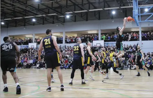  ??  ?? Eoin Quigley executes a spectacula­r dunk for Garvey’s Tralee Warriors in their Superleagu­e win over Keane’s SuperValu Killorglin last Saturday in Tralee