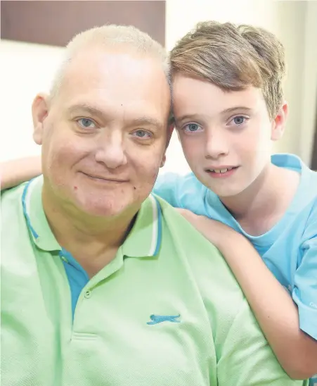  ??  ?? Callum Lane-Tingle, eight, with his dad, Andy Tingle, who was diagnosed with terminal cancer.