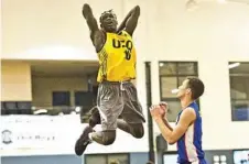  ??  ?? James Mbaryo gets airborne on his way to another monster jam for USQ.