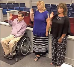  ?? Contribute­d photo ?? CASA has three new volunteers who were sworn in for service in June. Scott and Angelique Kauffman and Sandi Wilson-Shelley join the ranks of those helping foster children.