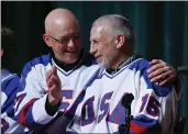  ?? MIKE GROLL — THE ASSOCIATED PRESS, FILE ?? Jack O’Callahan, left, and Mark Pavelich of the 1980 U.S. ice hockey team talk during a “Relive the Miracle” reunion at Herb Brooks Arena in Lake Placid, N.Y., in February 2015. Pavelich, 63, died at the Eagle’s Healing Nest in Sauk Centre, Minn., Thursday morning. The cause and manner of death are still pending.