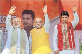  ?? PTI PHOTO ?? (From left) PM Narendra Modi, BJP chief Amit Shah and Tripura’s new chief minister Biplab Kumar Deb at the swearingin ceremony of the newly elected ministers in Agartala on Friday.
