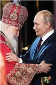  ?? ?? BOUND TOGETHER: Patriarch Kirill with Vladimir Putin.