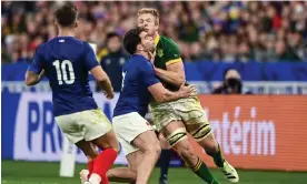  ?? Photograph: Harry Murphy/Sportsfile/Getty Images ?? South Africa’s Pieter-Steph du Toit is tackled by Damian Penaud during the quarter-final win against France.