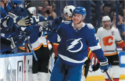  ?? AP PHOTO ?? Brayden Point of the Tampa Bay Lightning celebrates his first-period goal against the Calgary Flames on Tuesday in Tampa, Fla.