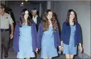  ?? GEORGE BRICH, FILE - THE ASSOCIATED PRESS ?? In this Aug. 20, 1970, file photo, Charles Manson followers, from left, Susan Atkins, Patricia Krenwinkel and Leslie Van Houten walk to court to appear for their roles in the 1969 cult killings of seven people in Los Angeles.