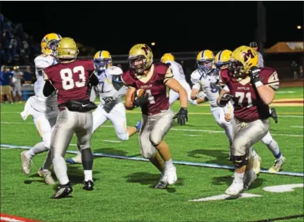  ?? AUSTIN HERTZOG - DIGITAL FIRST MEDIA FILE ?? Gov. Mifflin’s Isaac Ruoss had three rushing TDs last Friday as the Mustangs finished their unbeaten run through Section 1.