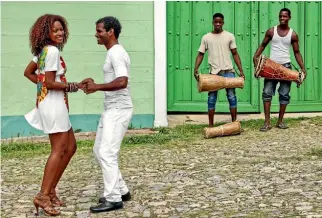  ?? ISTOCK ?? In Cuba, there’s plenty of dancing in the street.