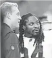  ?? MARK J. REBILAS, USA TODAY SPORTS ?? Raiders coach Jack Del Rio, shown with Marshawn Lynch, says, “We have the freedom to be ourselves.”