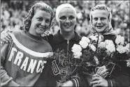  ?? AP FILE PHOTO ?? From left to right, Madeleine Moreau of France (silver medalist), Patricia McCormick, of the United States (gold); and American Zoe Jensen (bronze), pose after the women’s 3-meter springboar­d diving event at the 1952 Summer Olympics in Helsinki, Finland.