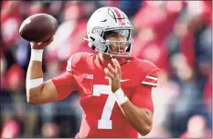  ?? Emilee Chinn / Getty Images ?? QB C.J. Stroud and No. 2 Ohio State will visit No. 6 Michigan on Saturday.