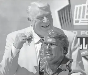  ?? Ron Jenkins/Fort Worth Star-telegram/tnS ?? John Madden stands with his bust at the Pro Football Hall of Fame induction ceremony in 2006.