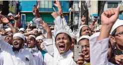  ??  ?? DHAKA: Activists from a Bangladesh Islamist group shout slogans as they take part in a protest calling for a statue referred to as a ‘Greek goddess’ installed at the Supreme Court to be destroyed or removed in Dhaka. —AFP