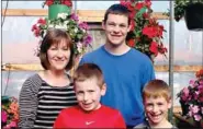  ?? LYNN KUTTER ENTERPRISE-LEADER ?? Chicken Holler in Farmington has all your gardening and landscape needs. Carla Gibson, who owns the business along with her husband, Jimmy Gibson, is pictured with employee Greyson Wynn and grandsons, Maddox Mahan and Mason Mahan.