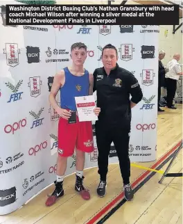  ??  ?? Washington District Boxing Club’s Nathan Gransbury with head coach Michael Wilson after winning a silver medal at the National Developmen­t Finals in Liverpool