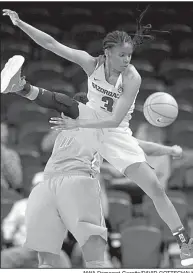  ?? NWA Democrat-Gazette/DAVID GOTTSCHALK ?? Arkansas guard Malica Monk leaps in the air while battling with Florida guard Dyandria Anderson to keep the ball from going out of bounds during the Razorbacks’ 65-51 loss to the Gators on Thursday at Walton Arena in Fayettevil­le. Monk scored a...