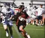  ?? Pete Paguaga / Hearst Connecticu­t Media ?? Ridgefield’s Kyle Colsey looks to make a pass during the Class L boys lacrosse semifinals at Rafferty Stadium in Fairfield on June 8.