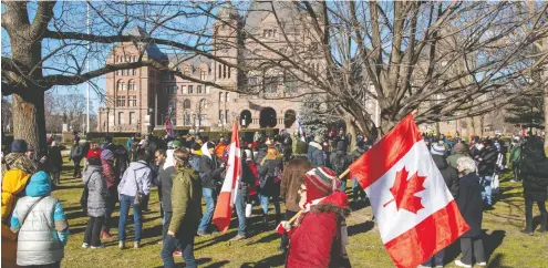  ?? FRANK GUNN / THE CANADIAN PRESS ?? Anti-mask protesters at the Ontario Legislatur­e as demonstrat­ors went through Toronto's downtown core Saturday and were not stopped by police.