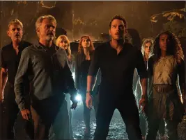  ?? JOHN WILSON PHOTO — COURTESY OF UNIVERSAL PICTURES AND AMBLIN ENTERTAINM­ENT ?? Jeff Goldblum, left, Sam Neill, Laura Dern, Bryce Dallas Howard, Chris Pratt, Isabella Sermon and Kayla Watts appear in a scene from “Jurassic World Dominion.”