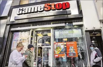  ?? John Minchillo Associated Press ?? GAMESTOP, the emblematic “meme stock,” has been hurtling back to Earth along with other fad assets. Its shares went from a low of $2.57 in April 2020 to $483 on Jan. 28, 2021, but they closed at $89.57 on Thursday.