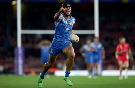  ?? GETTY IMAGES ?? Stephen Crichton celebrates a try for Samoa during their monumental upset Rugby League World Cup semifinal victory against England in London last weekend.