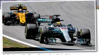  ?? PICTURES NELSON ALMEIDA ?? On the charge: Hamilton pulls away from Carlos Sainz