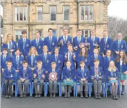  ??  ?? Big line-up Beaconhurs­t School senior and junior swim teams Success Relay swim winners Sebastiano Pacitti, Struan Craig, Murray Dickson and Cameron MacMillan Victory Swimmer Logan Eason with shield and medals