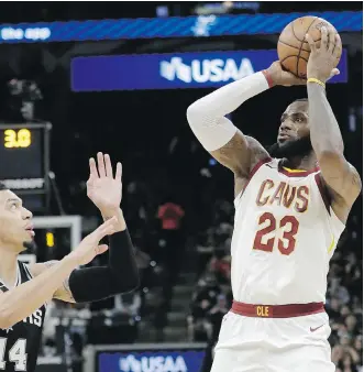  ?? ERIC GAY/THE ASSOCIATED PRESS ?? Cleveland Cavaliers forward LeBron James takes a shot Tuesday against the Spurs in San Antonio en route to surpassing a career milestone: 30,000 points scored in the NBA.