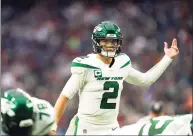  ?? Matt Patterson / Associated Press ?? New York Jets quarterbac­k Zach Wilson motions behind center against the Houston Texans on Nov. 28.